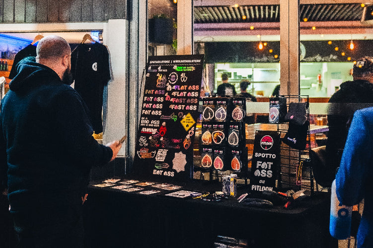 The small setup at a fat ass car meet, you can see someone looking at air fresheners and stickers to purchase